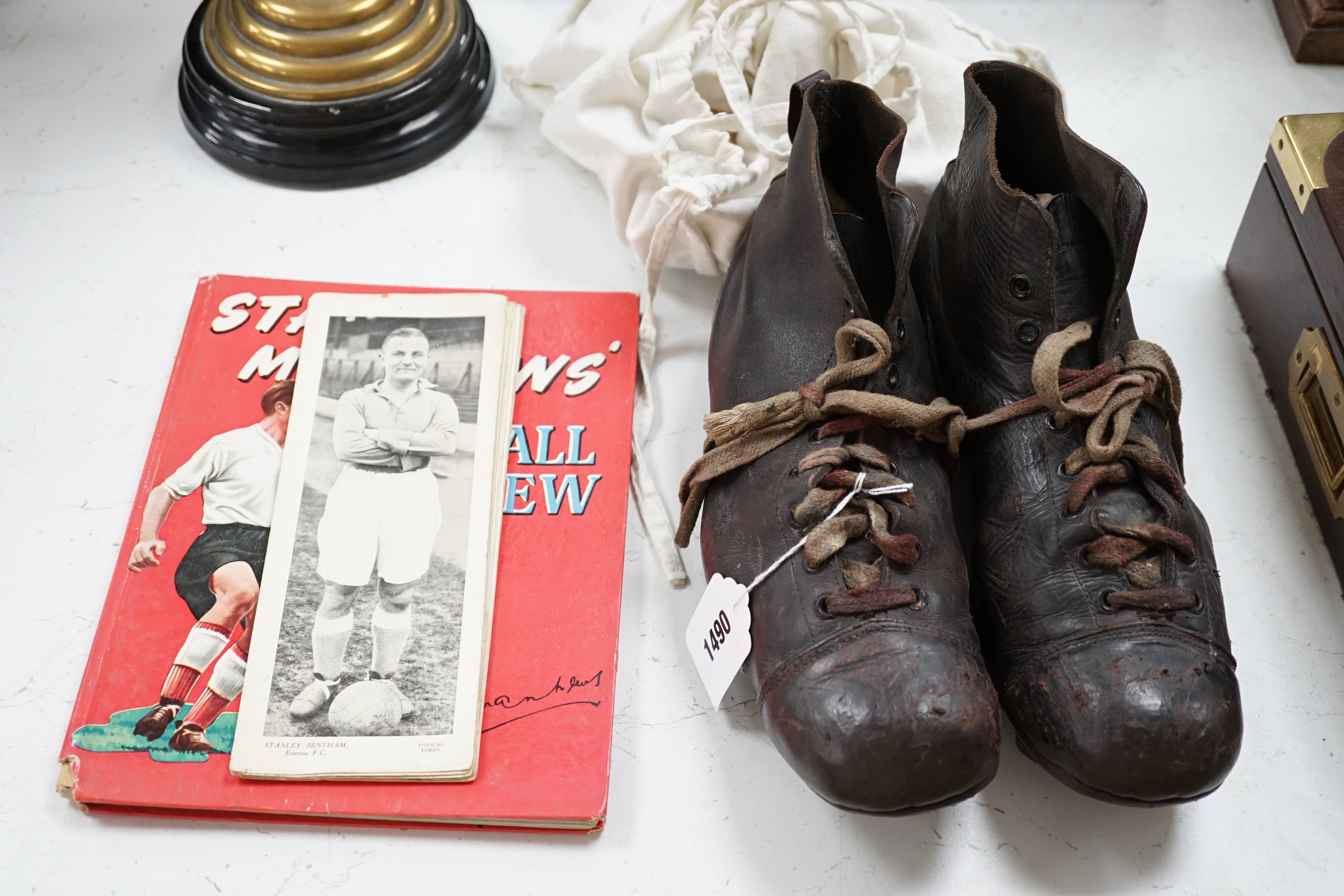 A pair of vintage Football boots and ephemera